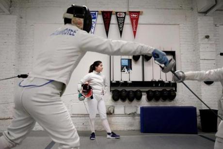  Sophie Yee, 17, waited for her partner during a training session at Bay State Fencers in Somerville on Friday.
