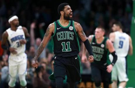 4-7-19: Boston, MA: The Celtics Kyrie Irving reacted after he hit a three pointer to make the score 99-98 Orlando. Boston had a big run in the fourth quarter, and eventually tied the game, but they couldn't maintain it and the Magic won, clinching the Southeast Division title. The Boston Celtics hosted the Orlando Magic in a regular season NBA basketball game at the TD Garden. (Jim Davis /Globe Staff). 
