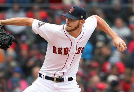 4-9-19: Boston, MA: Red Sox starting pitchher Chris Sale fires a pitch in the first inning.The Boston Red Sox played their home opener vs. the Toronto Blue Jays at Fenway Park. (Jim Davis /Globe Staff). 
