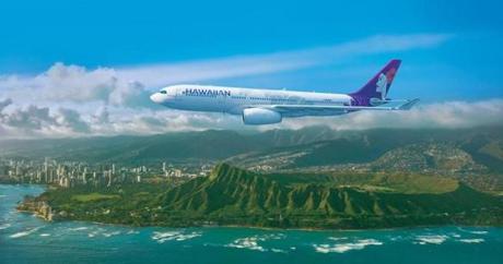 A Hawaiian Airlines plane flew by Diamond Head on Oahu.
