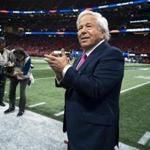 New England Patriots owner Robert Kraft walks onto the field before the Super Bowl in 2019
