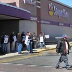 4-11-19: Somerville, MA: Workers at the Stop and Shop store on McGrath Highway walked off the job this afternoon. A customer (right) who decided not to cross the picket line left without entering the store. (Jim Davis /Globe Staff).