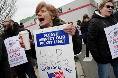 SOMERVILLE, MA - April 12, 2019: Stop & Shop worker Lynda Insogna, center, joins in a chant on the picket line at the Stop & Shop in Somerville, MA on April 12, 2019. US Senator Elizabeth Warren joined Stop & Shop workers walking a picket line outside a Somerville store as the strike against New England?s largest supermarket chain enters its first full day Friday. (Craig F. Walker/Globe Staff) section: Metro reporter:
