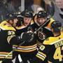 Boston-04/13/2019 Boston Bruins vs Toronto Maple Leafs- Playoffs game 2 -Bruins Charlie Coyle(center) is congratulated by Zdeno Chara(left), David Backes and Danton Heinen after his 1st period goal. Photo by John Tlumacki/Globe Staff(sports)