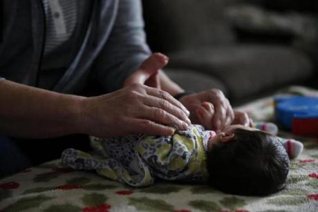 ONLY FOR KAY LAZAR STORY Bondsville, MA, 03/17/2019 -- Gayle Suzor takes care of a 15 day-old foster child at her home. (Jessica Rinaldi/Globe Staff) Topic: Reporter: Kay Lazar
