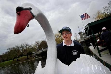 BOSTON, MA - April 13, 2019: Swan Boat captain Jack Barden pedals his boat away from the dock at the Public Garden in Boston, MA on April 13, 2019. The Paget Family's Swan Boats returned to the Lagoon for the 143rd season. (Craig F. Walker/Globe Staff) section: Metro reporter:
