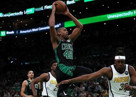 Boston, MA - 4/14/2019 - (1st quarter) Boston Celtics center Al Horford (42) soars in for a first quarter dunk. The Boston Celtics host the Indiana Pacers in Game 1 of Round 1 of the Eastern Conference Playoffs at TD Garden. - (Barry Chin/Globe Staff), Section: Sports, Reporter: Adam Himmelsbach, Topic: 15Celtics-Pacers, LOID: 8.5.976022636.
