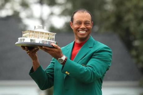 AUGUSTA, GEORGIA - APRIL 14: Tiger Woods of the United States celebrates after sinking his putt on the 18th green to win during the final round of the Masters at Augusta National Golf Club on April 14, 2019 in Augusta, Georgia. (Photo by Kevin C. Cox/Getty Images)
