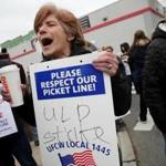 SOMERVILLE, MA - April 12, 2019: Stop & Shop worker Lynda Insogna, center, joins in a chant on the picket line at the Stop & Shop in Somerville, MA on April 12, 2019. US Senator Elizabeth Warren joined Stop & Shop workers walking a picket line outside a Somerville store as the strike against New England?s largest supermarket chain enters its first full day Friday. (Craig F. Walker/Globe Staff) section: Metro reporter: