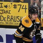 Boston-04/13/2019 Boston Bruins vs Toronto Maple Leafs- Playoffs game 2 -Bruins Jake DeBrusk passes by a sign during pregame warmups. Photo by (sports)