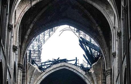 Cathedral SLIDER Daylight shines through the fallen roof structure of Notre Dame Cathedral following the fire in Paris on April 16, 2019. MUST CREDIT: Bloomberg photo by Christophe Morin.
