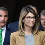 Boston, MA - 4/3/19 Lori Loughlin (cq) and her husband Mossimo Giannulli (cq) (green tie) leave court. More parents accused of bribery in the college admissions scandal appear at federal court. Photo by Pat Greenhouse/Globe Staff Topic: 04collegescandal