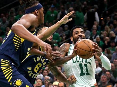 Boston, MA - 4/17/2019 - (1st quarter) Boston Celtics guard Kyrie Irving (11) takes a trip to the basket during the first quarter. The Boston Celtics host the Indiana Pacers in Game 2 of Round 1 of the Eastern Conference Playoffs at TD Garden. - (Barry Chin/Globe Staff), Section: Sports, Reporter: Adam Himmelsbach, Topic: 18Celtics-Pacers, LOID: 8.5.1015682352.
