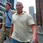 Boston, MA: 7-25-18: Retired Massachusetts State Trooper Daren DeJong (right) is pictured as he leaves the Moakley Federal Courthouse after being arraigned inside for embezzlement. His lawyer Brad Bailey is with him. (Jim Davis/Globe Staff)