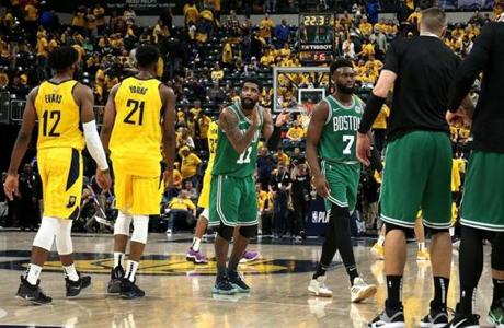 Indiannapolis, IN - 4/19/2019 - (4th quarter) with 22.3 seconds left in the game and the win in hand Boston Celtics guard Kyrie Irving (11) applauds his team's effort. The Indiana Pacers host the Boston Celtics in Game 3 of Round 1 of the Eastern Conference Playoffs at Bankers Life Field House. - (Barry Chin/Globe Staff), Section: Sports, Reporter: Adam Himmelsbach, Topic: 20Celtics-Pacers, LOID: 8.5.1024795915.
