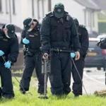 Police officers searched near the scene in the Creggan area of Derry where journalist Lyra McKee was fatally shot.