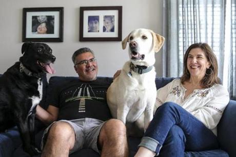 Rick Rodriguez and Gayle Saks, with Lola and Gronk, in their dog-friendly apartment. 
