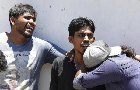 Relatives of people killed in church blasts mourned as they waited outside of a hospital in Colombo, Sri Lanka, on Sunday. 
