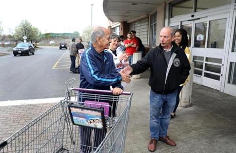 Union member Bob Berman (right) spoke with Bishnu Joarder of Roxbury, who agreed not to cross the picket line and shop at the Stop & Shop in South Bay.
