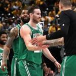 Indiannapolis, IN - 4/21/2019 - (4th quarter) Boston Celtics guard Kyrie Irving (11), Boston Celtics forward Marcus Morris (13), and Boston Celtics forward Gordon Hayward (20) are greeted by Boston Celtics forward Daniel Theis as they head off court after a time out was called following a Hayward jumper that put the Celtics up 102-92 with 1:04 left in the fourth quarter. The Indiana Pacers host the Boston Celtics in Game 4 of Round 1 of the Eastern Conference Playoffs at Bankers Life Field House. - (Barry Chin/Globe Staff), Section: Sports, Reporter: Adam Himmelsbach, Topic: 22Celtics-Pacers, LOID: 8.5.1054786590.