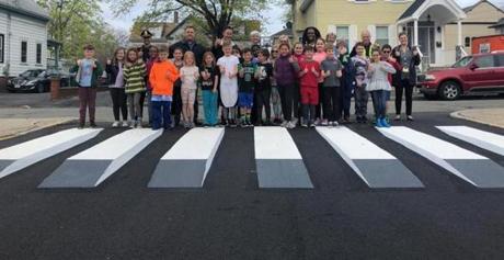 Students and local officials gather outside the Brooks Elementary School in Medford on Monday for the unveiling of a three-dimensional crosswalk. (City of Medford / Mayor's office) 23crosswalk
