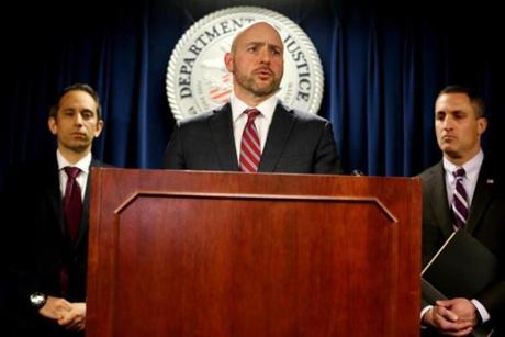 BOSTON, MA - March 12, 2019: - U.S. Attorney Andrew E. Lelling, center, held a press conference at the federal courthouse in Boston MA on March 12, 2019. He announce charges against dozens of individuals involved in a nationwide college admissions cheating and recruitment scheme. Lelling is accompanied by prosecutor Eric Rosen of the U.S. Attorney's office, left, and Special Agent in Charge Federal Bureau of Investigation Joseph R. Bonavolonta (Craig F. Walker/Globe Staff) section: Metro reporter:
