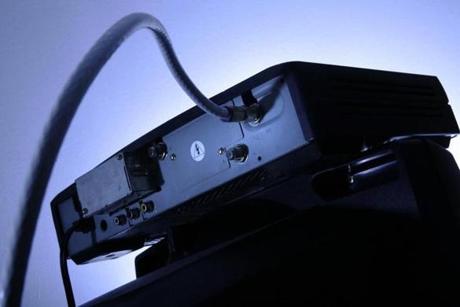 FILE - This May 30, 2007, file photo shows a cable box on top of a television in Philadelphia. Cable executives derided the online TV packages? cost as unrealistically cheap, but they were fairly popular, while cord-cutting picked up. (AP Photo/Matt Rourke, File)
