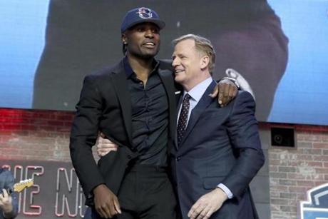 Newly drafted Patriot Joejuan Williams with NFL Commissioner Roger Goodell.
