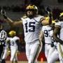 PISCATAWAY, NJ - NOVEMBER 10: Chase Winovich #15 of the Michigan Wolverines pumps up the crowd against the Rutgers Scarlet Knights during the third quarter at HighPoint.com Stadium on November 10, 2018 in Piscataway, New Jersey. Michigan won 42-7. (Photo by Corey Perrine/Getty Images)