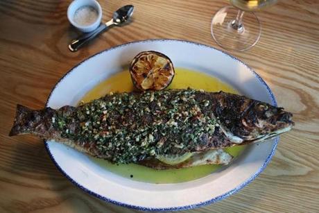 The whole branzino with a sauce of lemon, garlic, and herbs at Buttonwood Restaurant.
