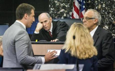 Judge Leonard Hanser holds a bench conference with attorneys during a motion hearing in the Robert Kraft's case in West Palm Beach, Fla., Friday, April 26, 2019. (Lannis Waters/Palm Beach Post via AP)
