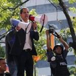 Opposition leader Juan Guaidó spoke to supporters as he called for the military to rise up and oust President Nicolas Maduro in Altamira Plaza in Caracas, Venezuela, on Tuesday.